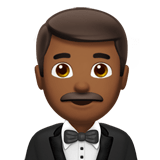 Man in Tuxedo Emoji with Medium-Dark Skin Tone, Apple style