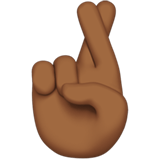 Crossed Fingers Emoji with Medium-Dark Skin Tone, Apple style
